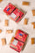 Doce de leite Uai Vida — flat-lay top-down de dois pacotes Kit Harmonia em fundo bege